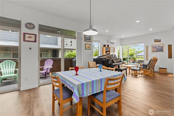 a view of a dining room with furniture window and wooden floor