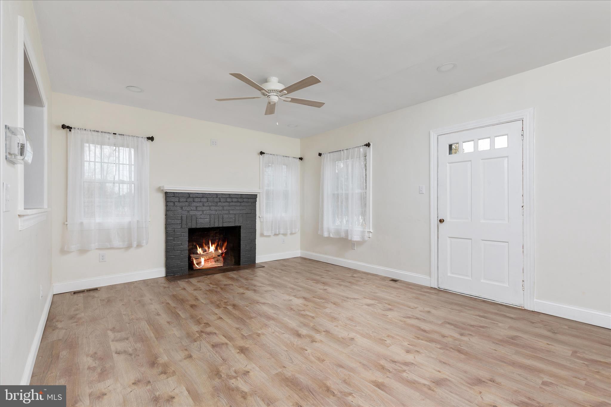 5655 Strasburg Road Strasburg, VA 22657 - Photo 20 of 85 a view of empty room with a fireplace and fan