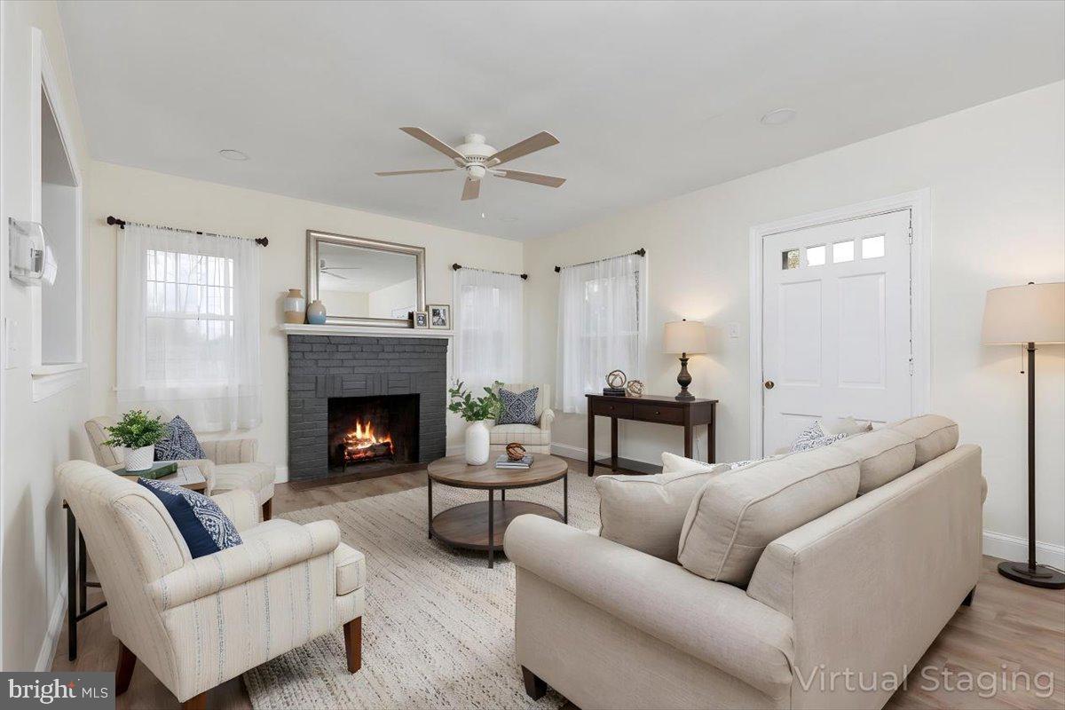 5655 Strasburg Road Strasburg, VA 22657 - Photo 2 of 85 a living room with furniture and a fireplace