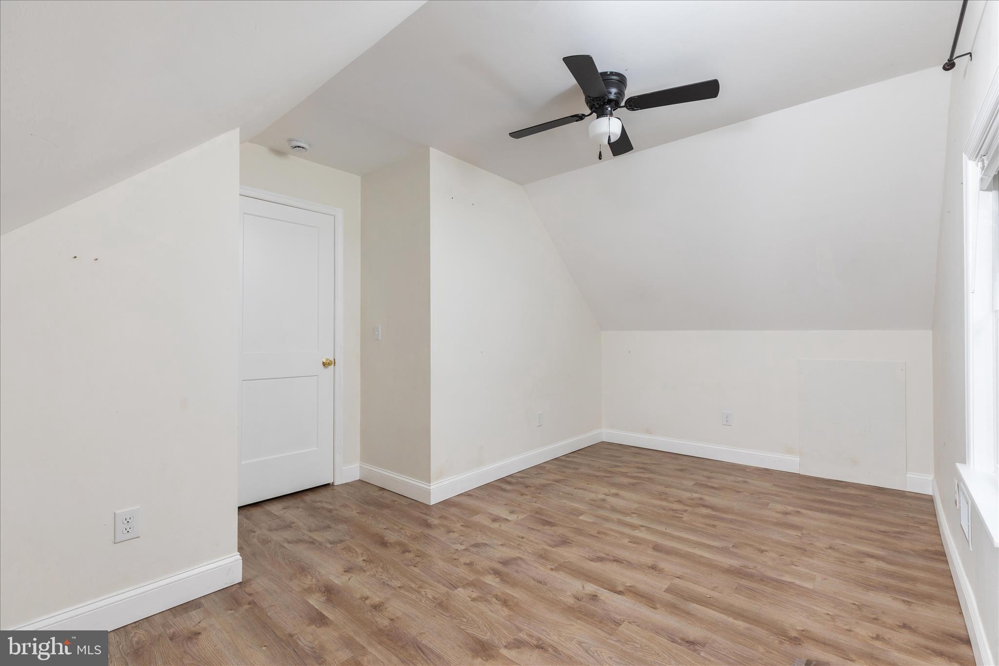 5655 Strasburg Road Strasburg, VA 22657 - Photo 32 of 85 a view of a room with wooden floor and a ceiling fan