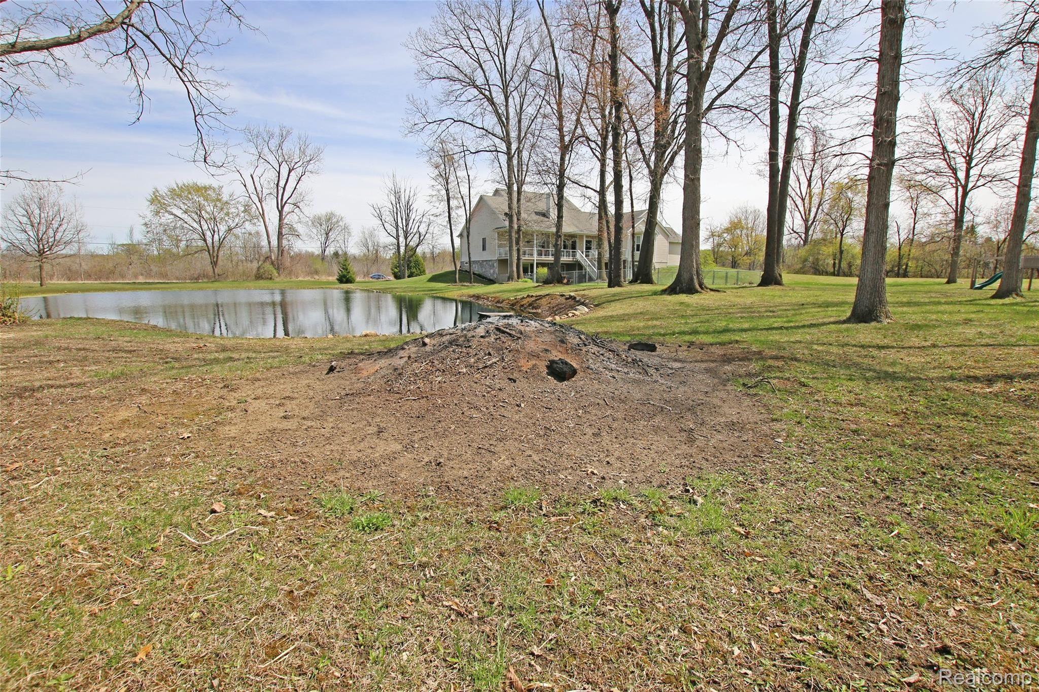 9026 Washburn Road Goodrich, MI 48438 - Photo 59 of 74 59) Backyard Fire Pit.jpg