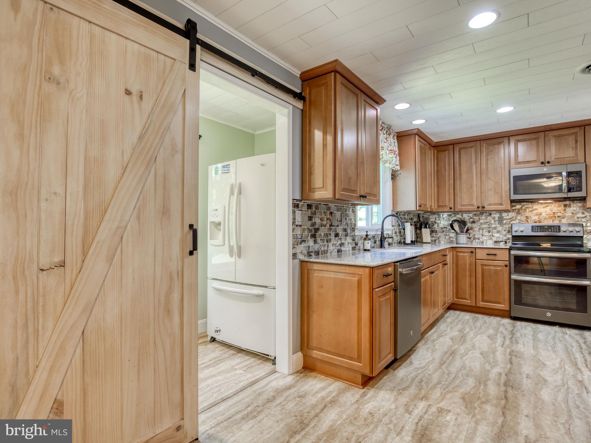 229 High Banks Road Stephenson, VA 22656 - Photo 14 of 63 Room off kitchen with extra fridge.