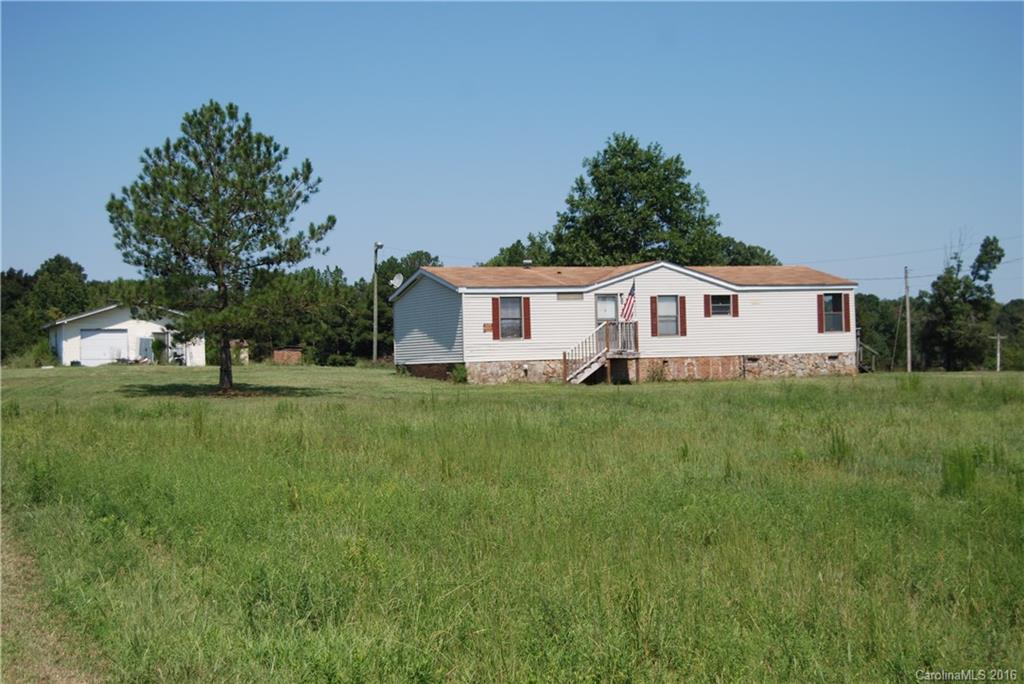 3224 Belk Mill Road Wingate, NC 28174 - Photo 2 of 13 a house view with a garden space