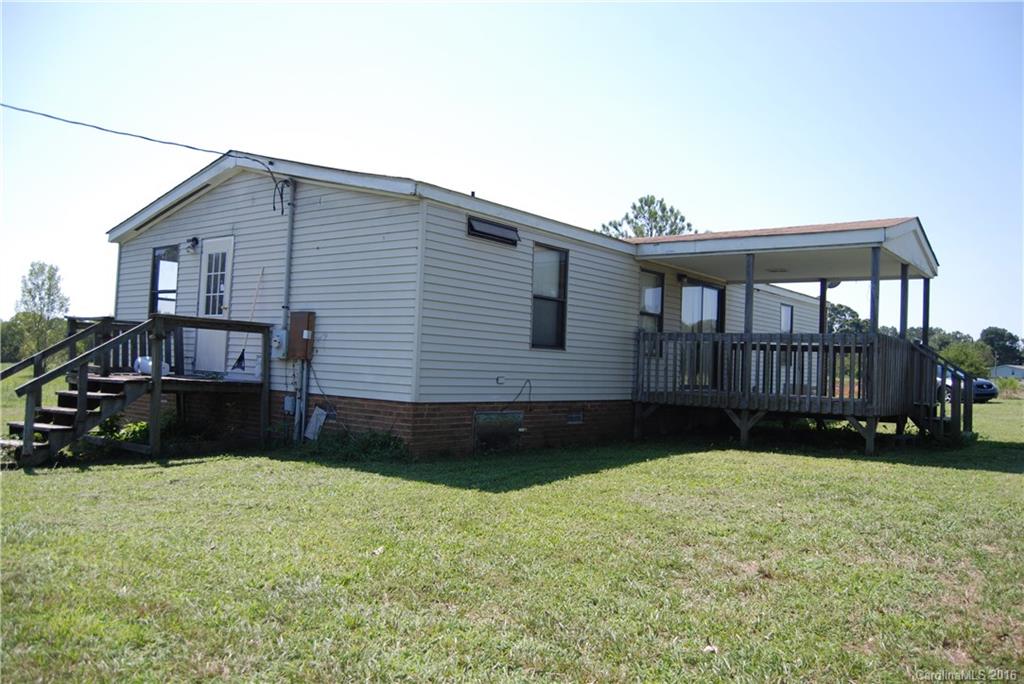 3224 Belk Mill Road Wingate, NC 28174 - Photo 11 of 13 a view of house with yard and outdoor seating
