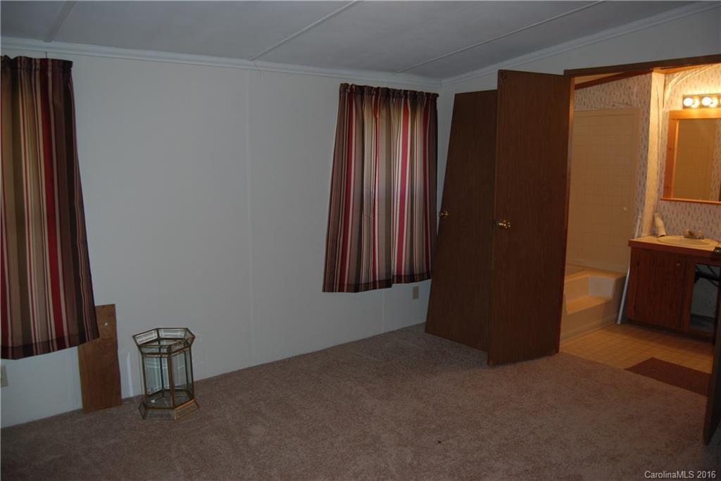 3224 Belk Mill Road Wingate, NC 28174 - Photo 8 of 13 an empty room with windows