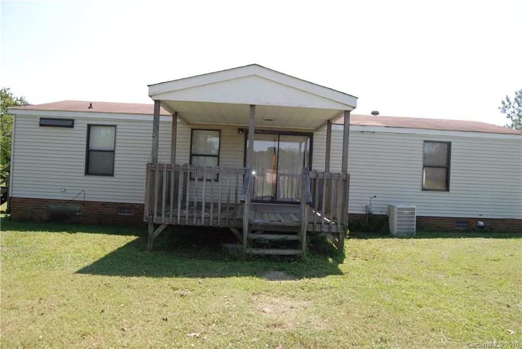 3224 Belk Mill Road Wingate, NC 28174 - Photo 10 of 13 a front view of a house with a yard