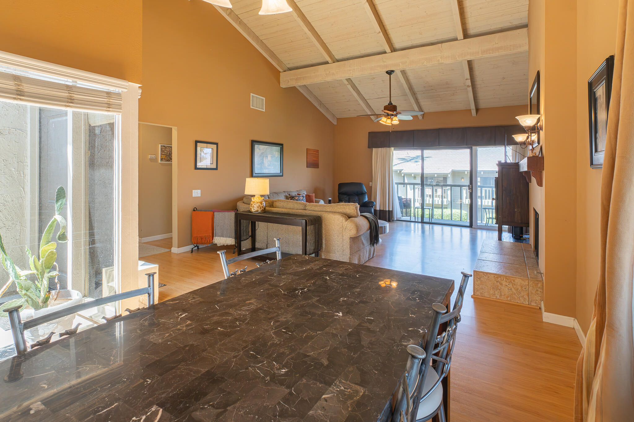 46631 Arapahoe, Unit B Indian Wells, CA 92210 - Photo 16 of 32 a view of a dining room with furniture wooden floor and a chandelier