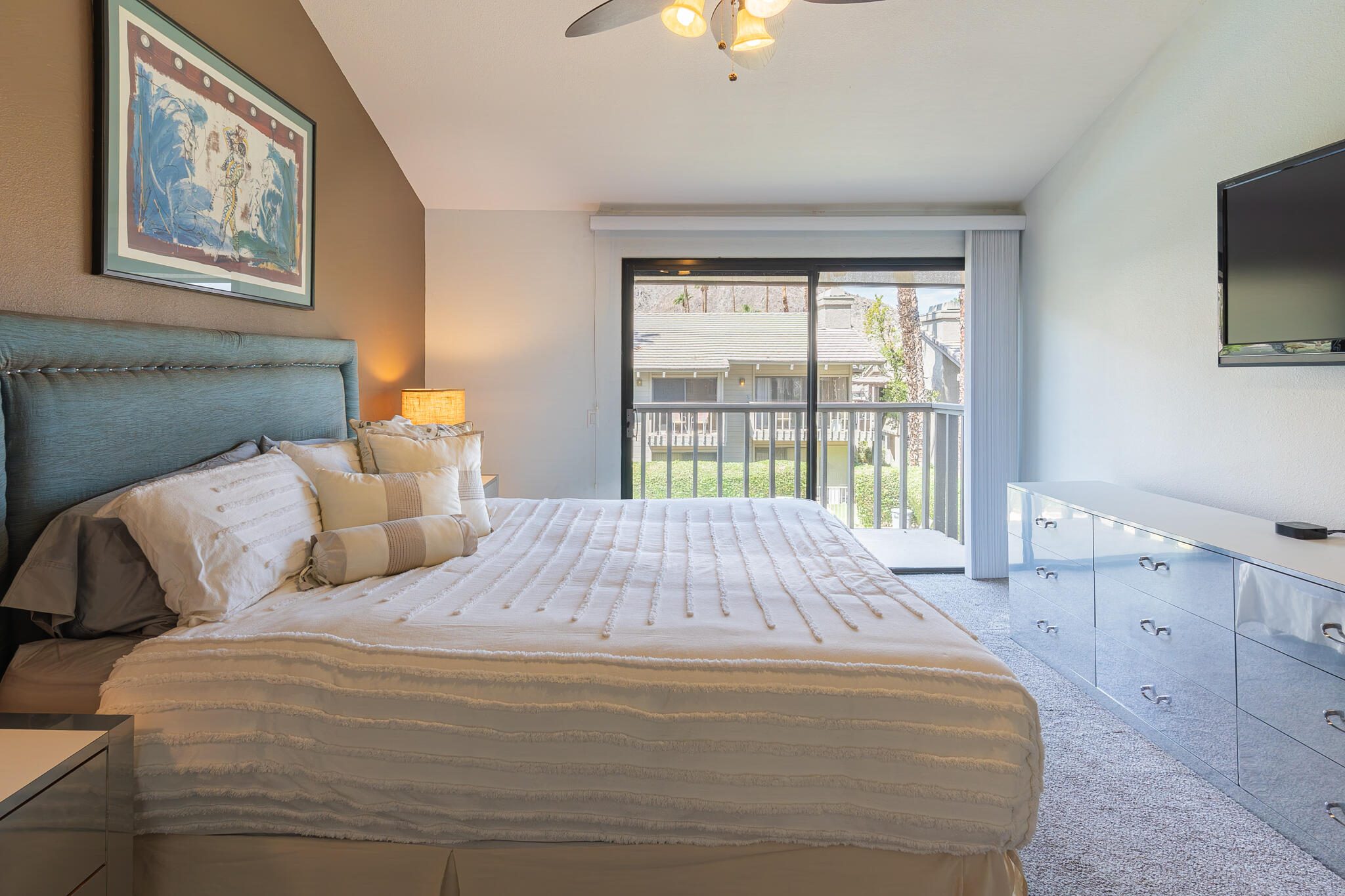 46631 Arapahoe, Unit B Indian Wells, CA 92210 - Photo 19 of 32 a bed sitting in a bedroom next to a window