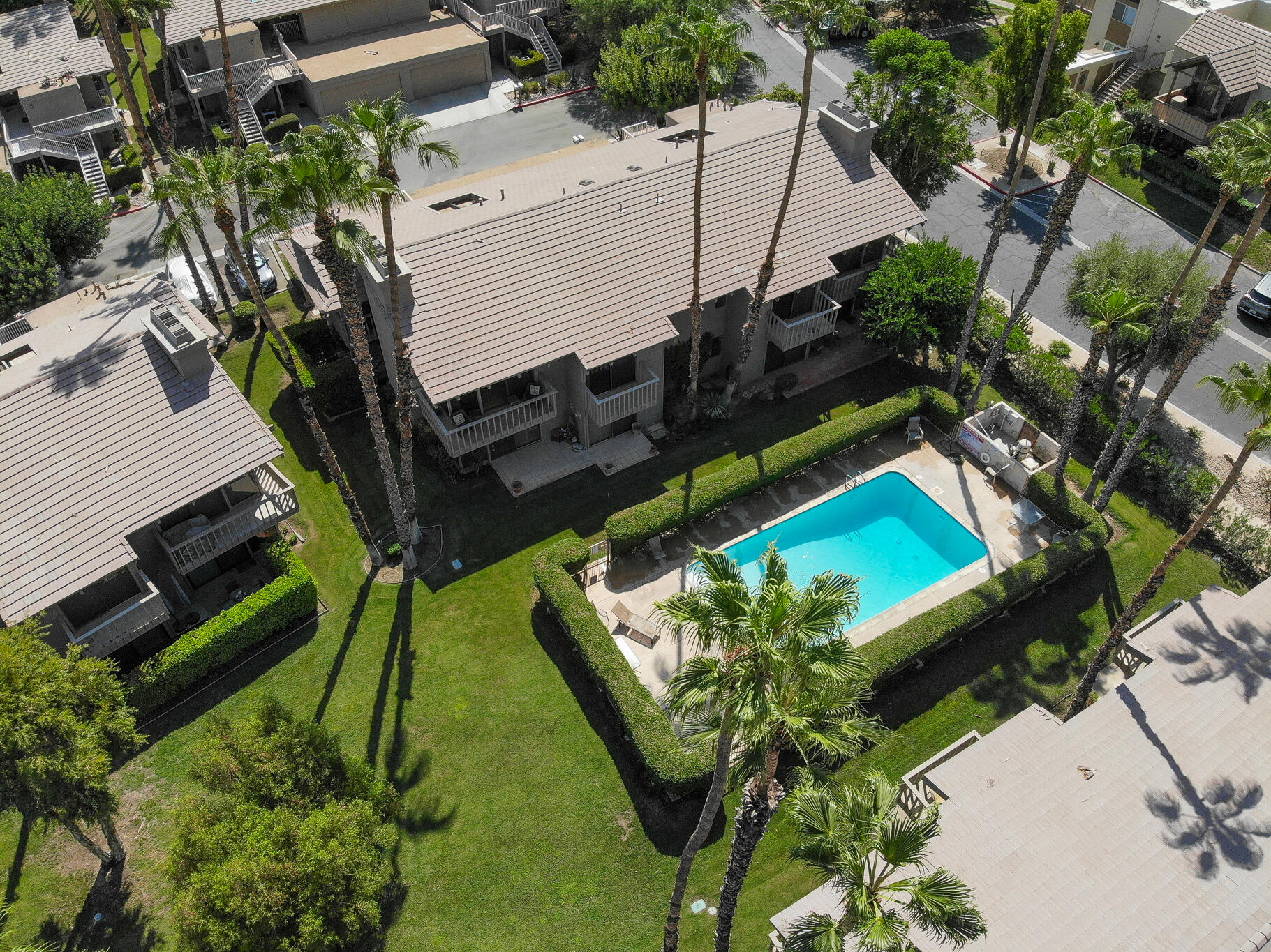 46631 Arapahoe, Unit B Indian Wells, CA 92210 - Photo 2 of 32 an aerial view of a pool with patio