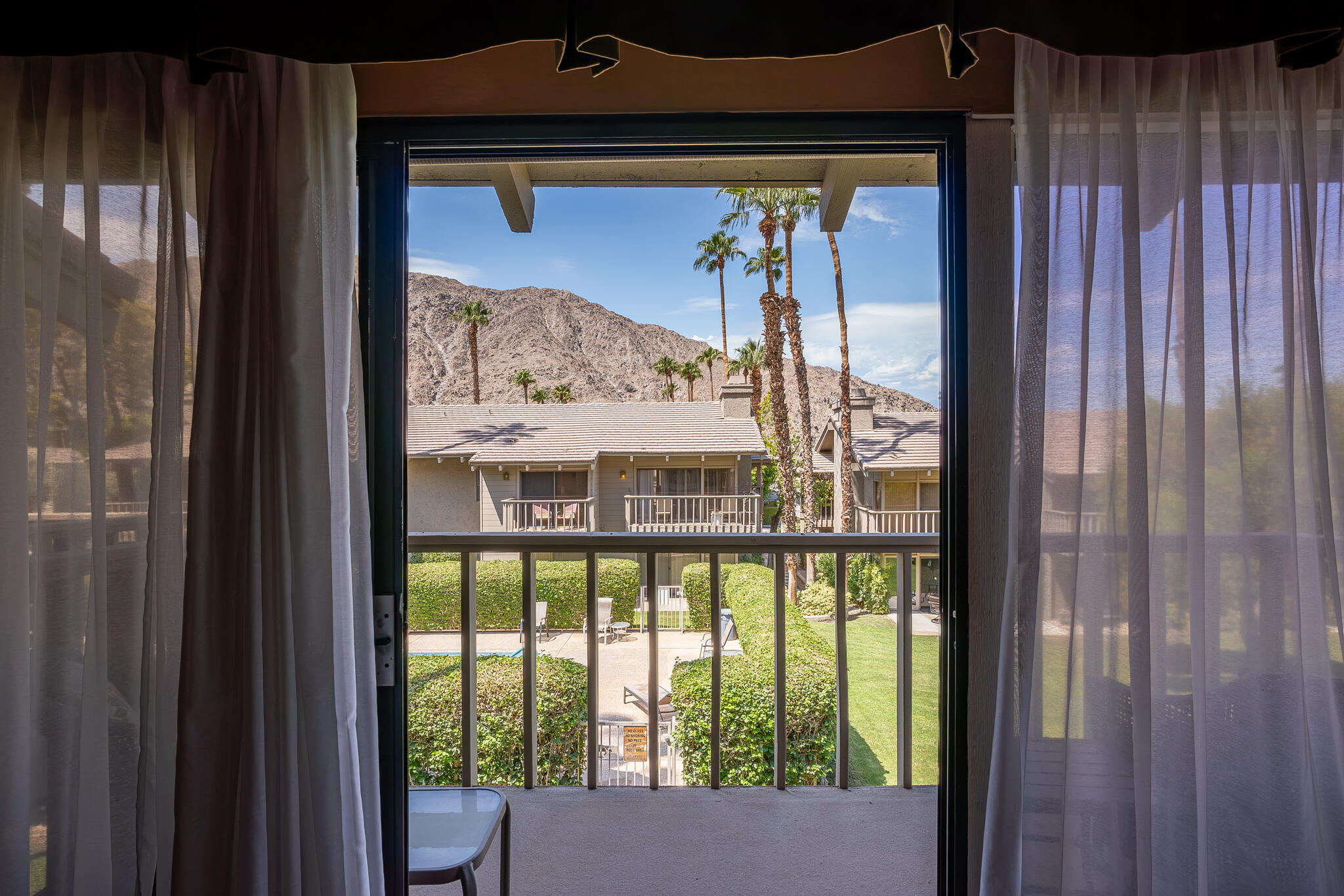 46631 Arapahoe, Unit B Indian Wells, CA 92210 - Photo 28 of 32 a view of a porch with a door and front door
