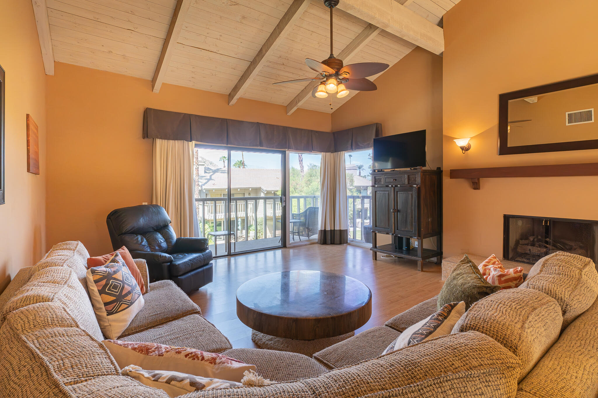 46631 Arapahoe, Unit B Indian Wells, CA 92210 - Photo 7 of 32 a living room with furniture a chandelier and a large window