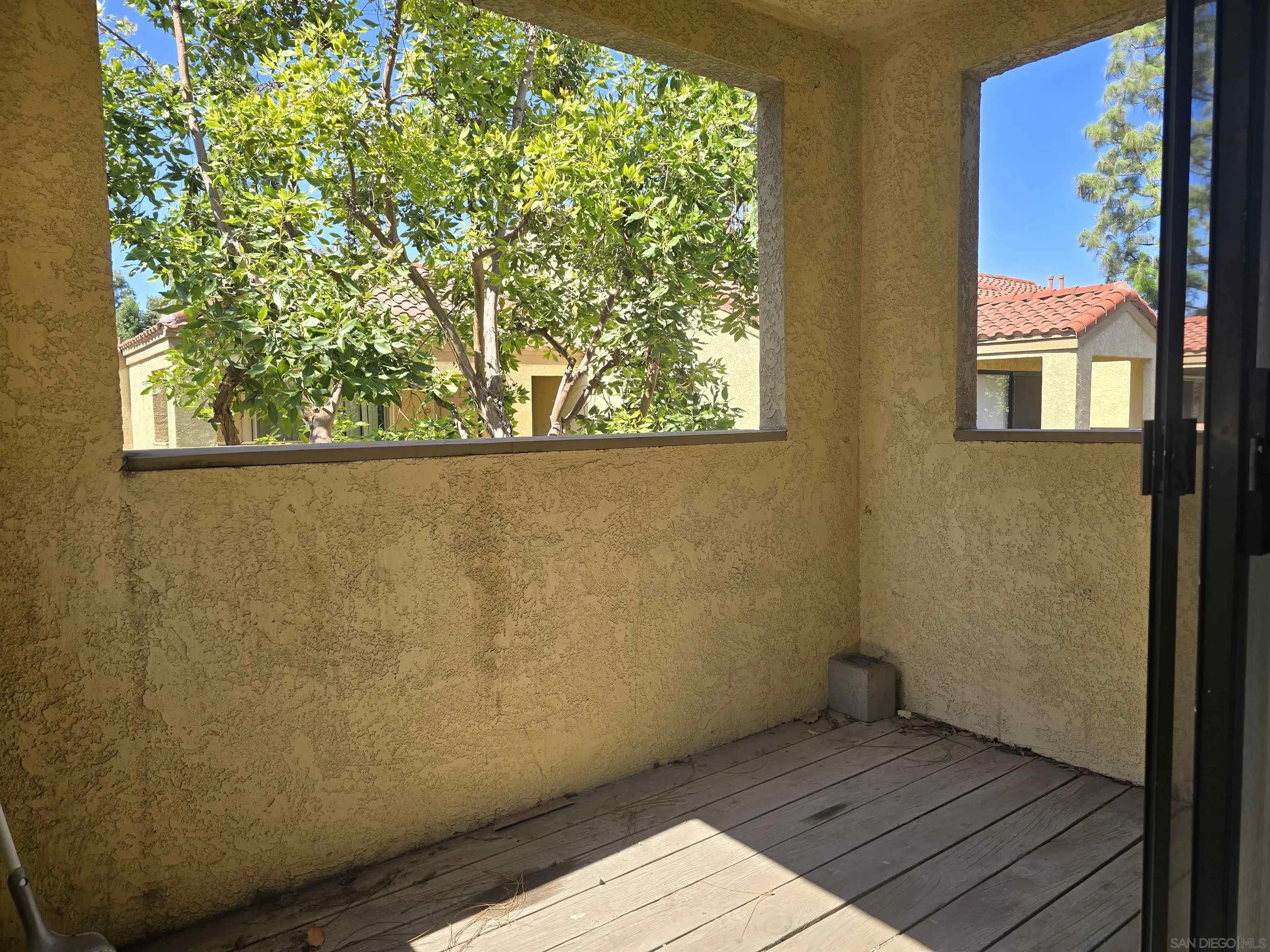 1130 West Blaine Street, Unit 204 Riverside, CA 92507 - Photo 15 of 24 a view of a small space with wooden floor and a window