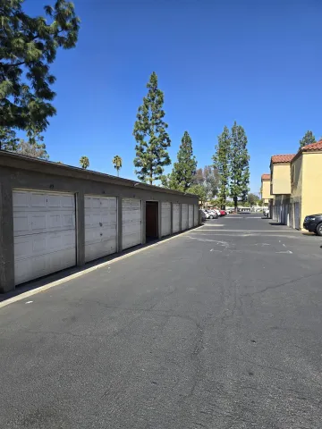 a view of a car park in front of a house