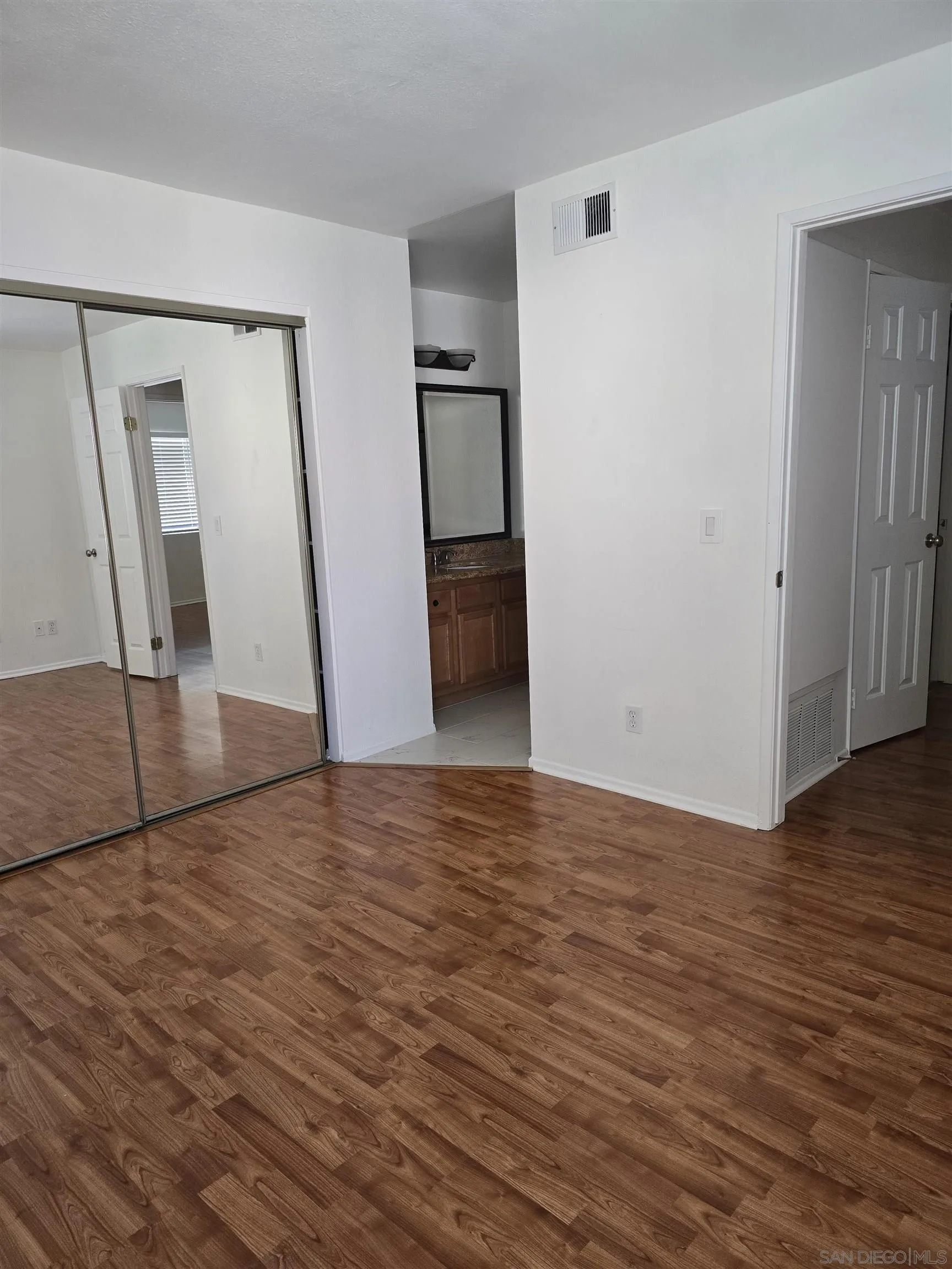 1130 West Blaine Street, Unit 204 Riverside, CA 92507 - Photo 23 of 24 a view of empty room with wooden floor