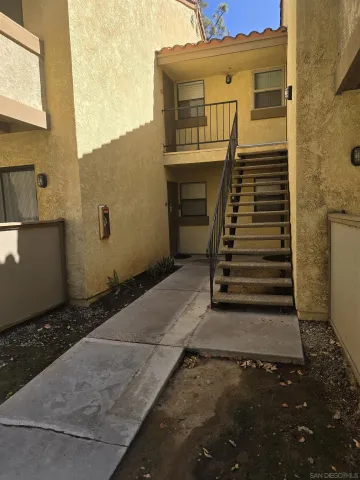 a view of a back yard of the building