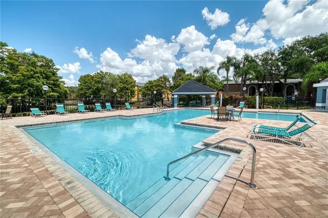 a view of a swimming pool with lounge chair