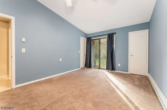 a view of a room with a large window