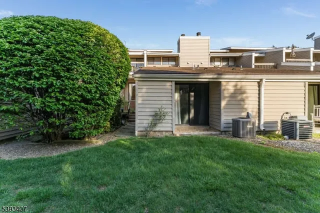 a view of a house with a yard and plants