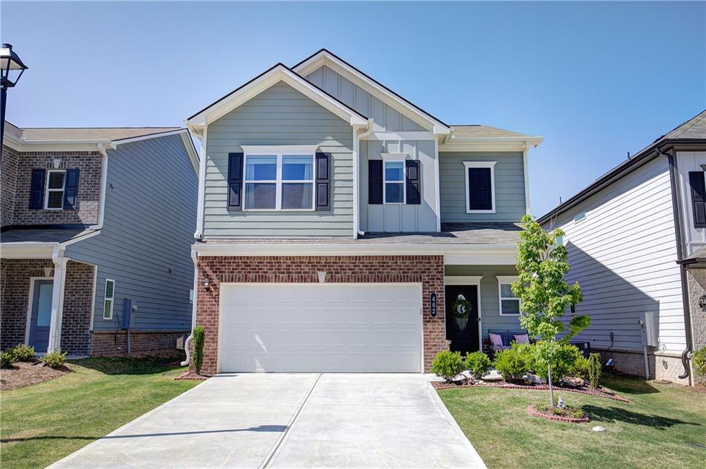 402 Perth Drive Cartersville, GA 30121 - Photo 1 of 31 a front view of a house with a garden