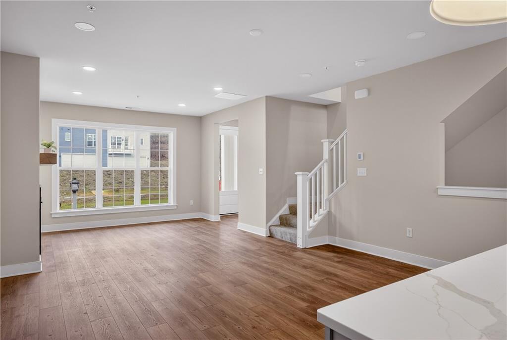 4022 Cottage Way Bridgeville, PA 15017 - Photo 13 of 47 a view of an empty room with wooden floor and a window