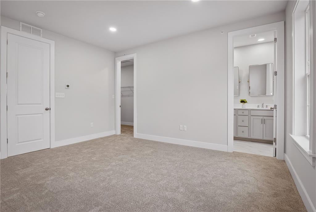 4022 Cottage Way Bridgeville, PA 15017 - Photo 29 of 47 an empty room with a bathroom and mirror