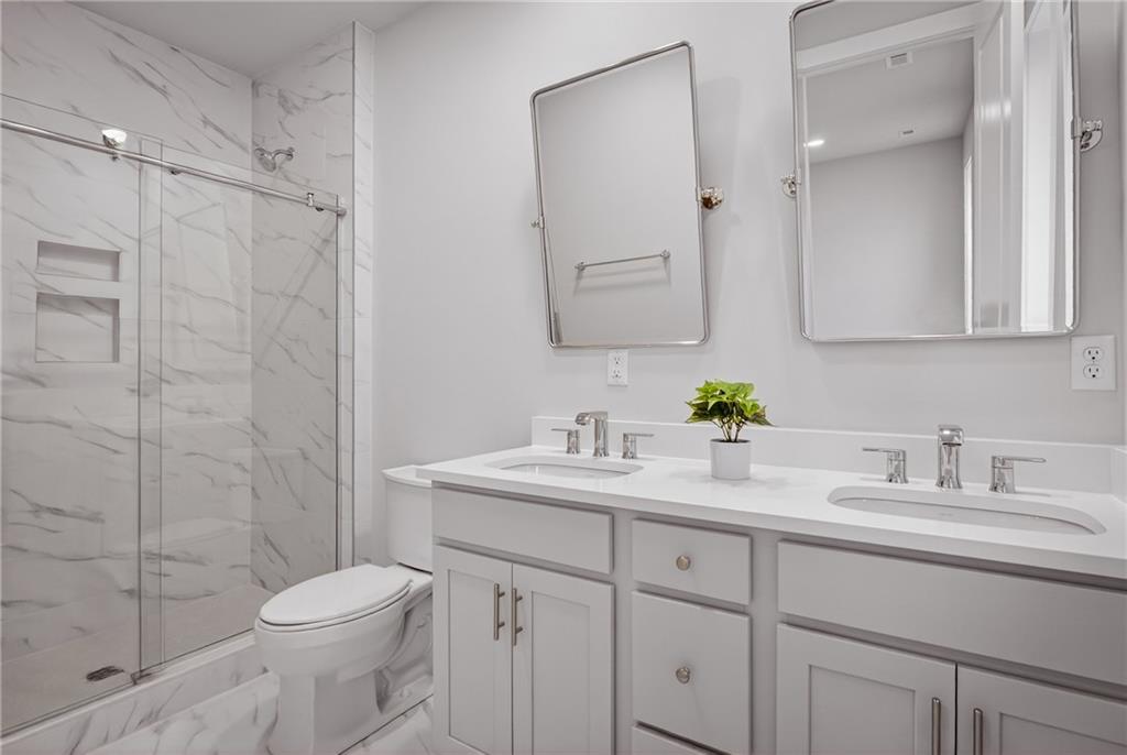 4022 Cottage Way Bridgeville, PA 15017 - Photo 30 of 47 a bathroom with a sink a toilet and shower