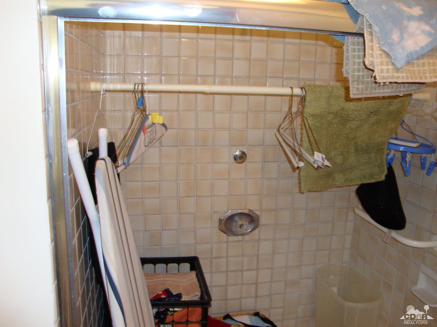 66671 San Rafael Road Desert Hot Springs, CA 92240 - Photo 15 of 36 a bathroom with a shower