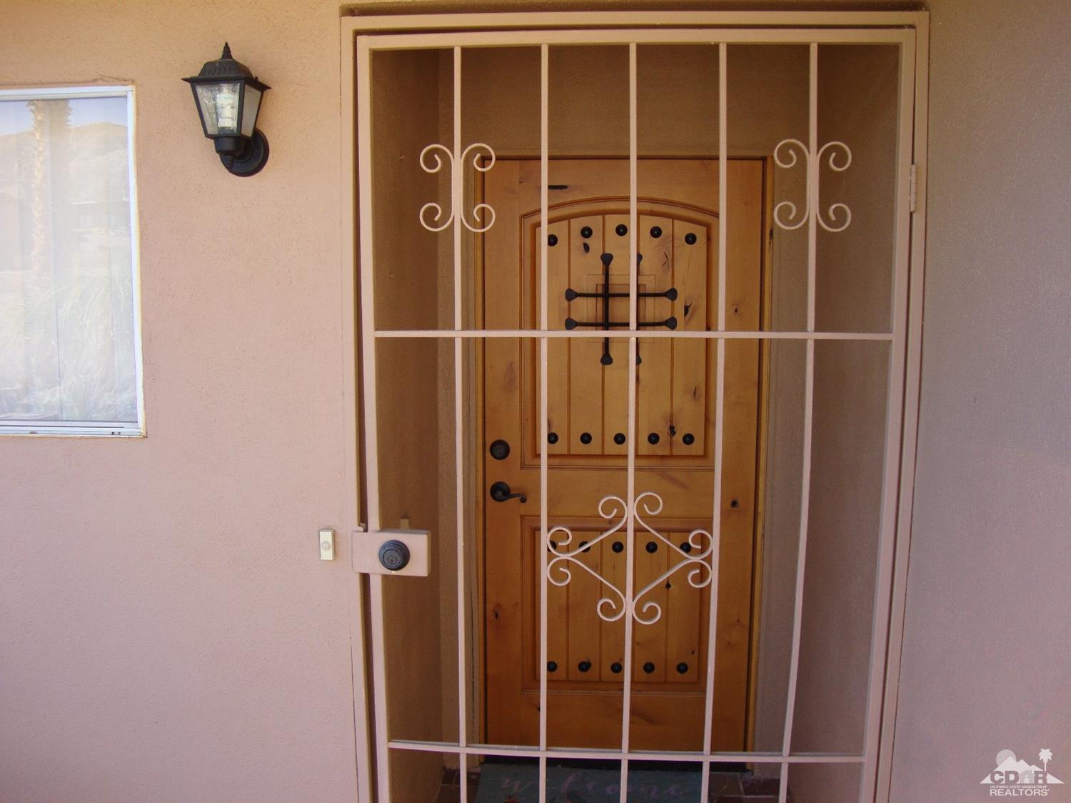 66671 San Rafael Road Desert Hot Springs, CA 92240 - Photo 3 of 36 a view of a door