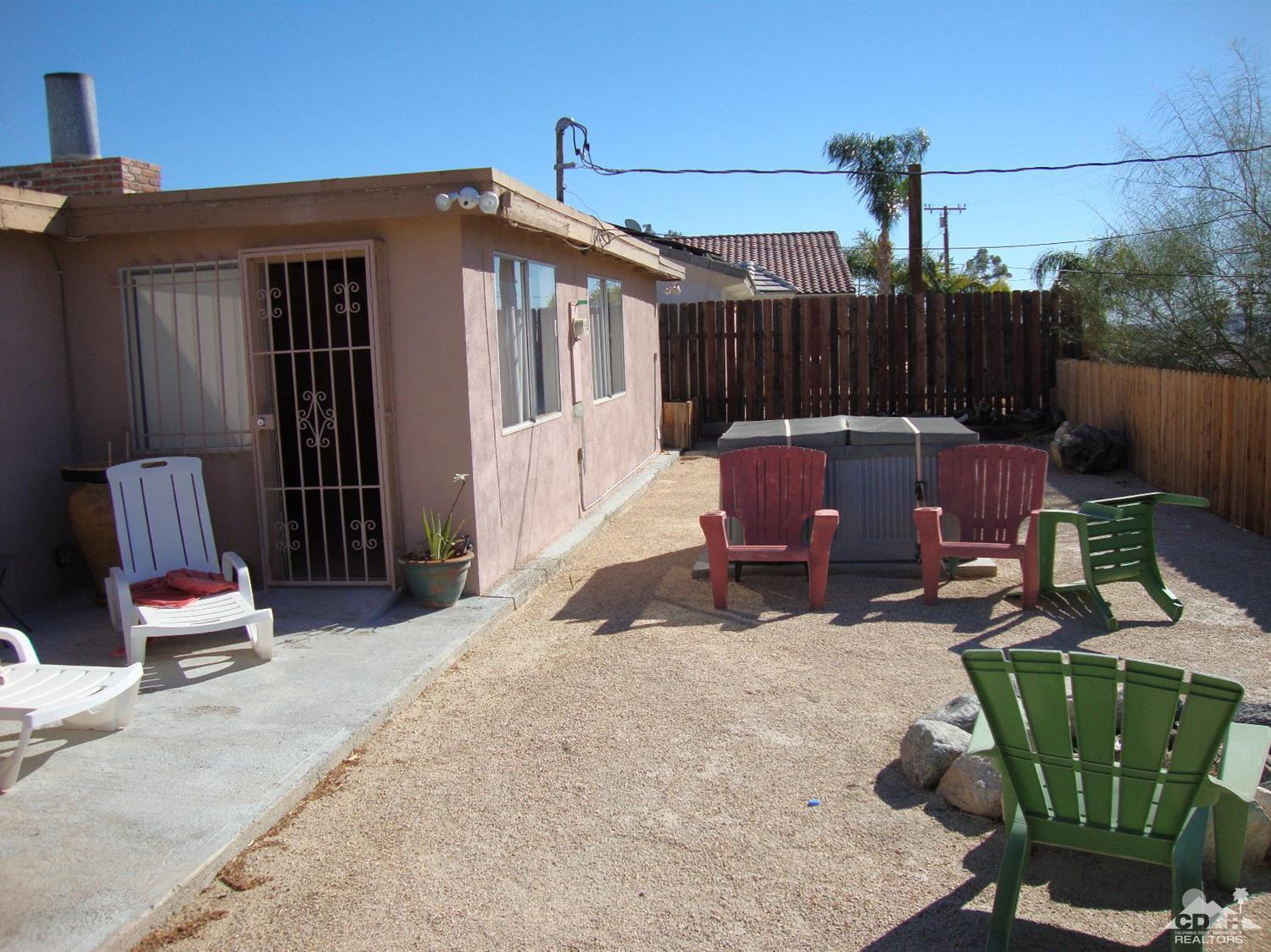 66671 San Rafael Road Desert Hot Springs, CA 92240 - Photo 30 of 36 a building outdoor space with patio furniture