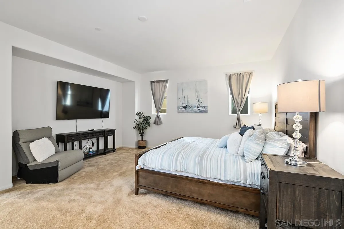 1333 Pershing Road Chula Vista, CA 91913 - Photo 17 of 30 a bedroom with a bed and a flat screen television