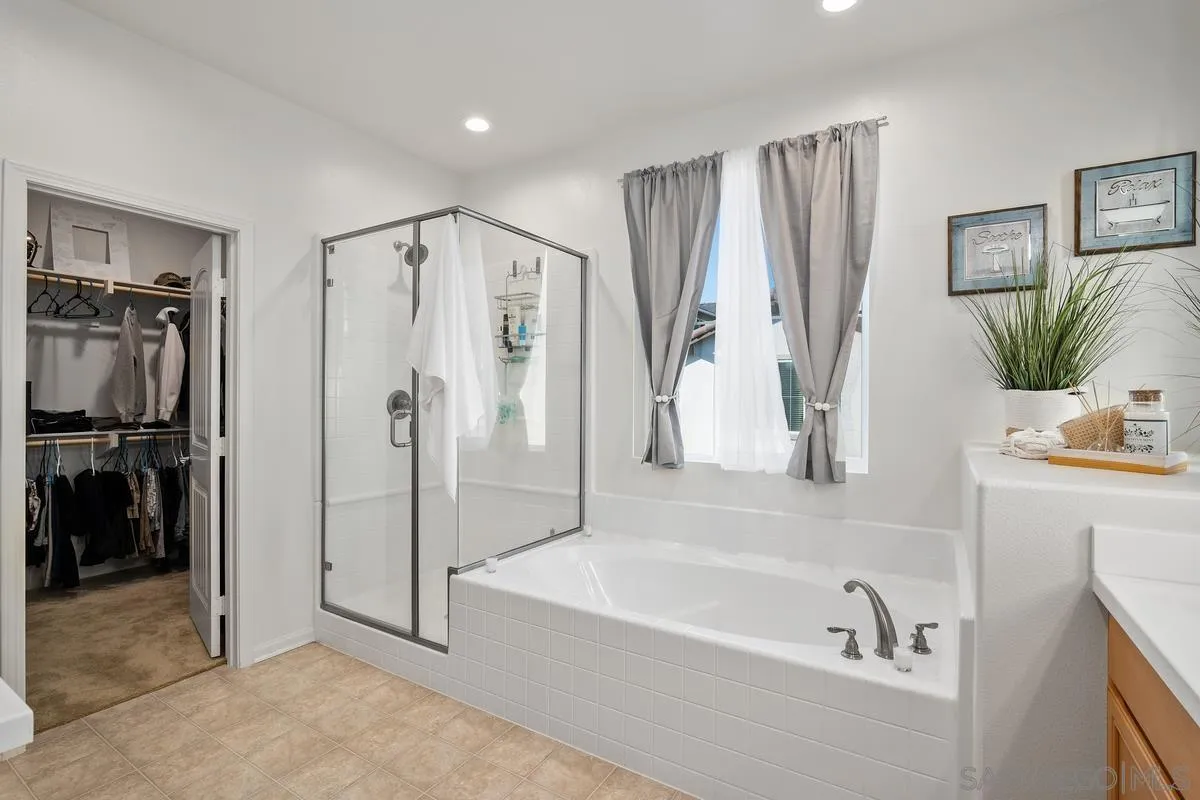 1333 Pershing Road Chula Vista, CA 91913 - Photo 20 of 30 a bathroom with a tub a sink and a shower