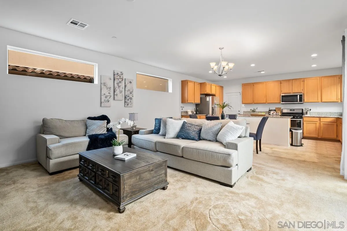 1333 Pershing Road Chula Vista, CA 91913 - Photo 6 of 30 a living room with furniture kitchen view and a chandelier