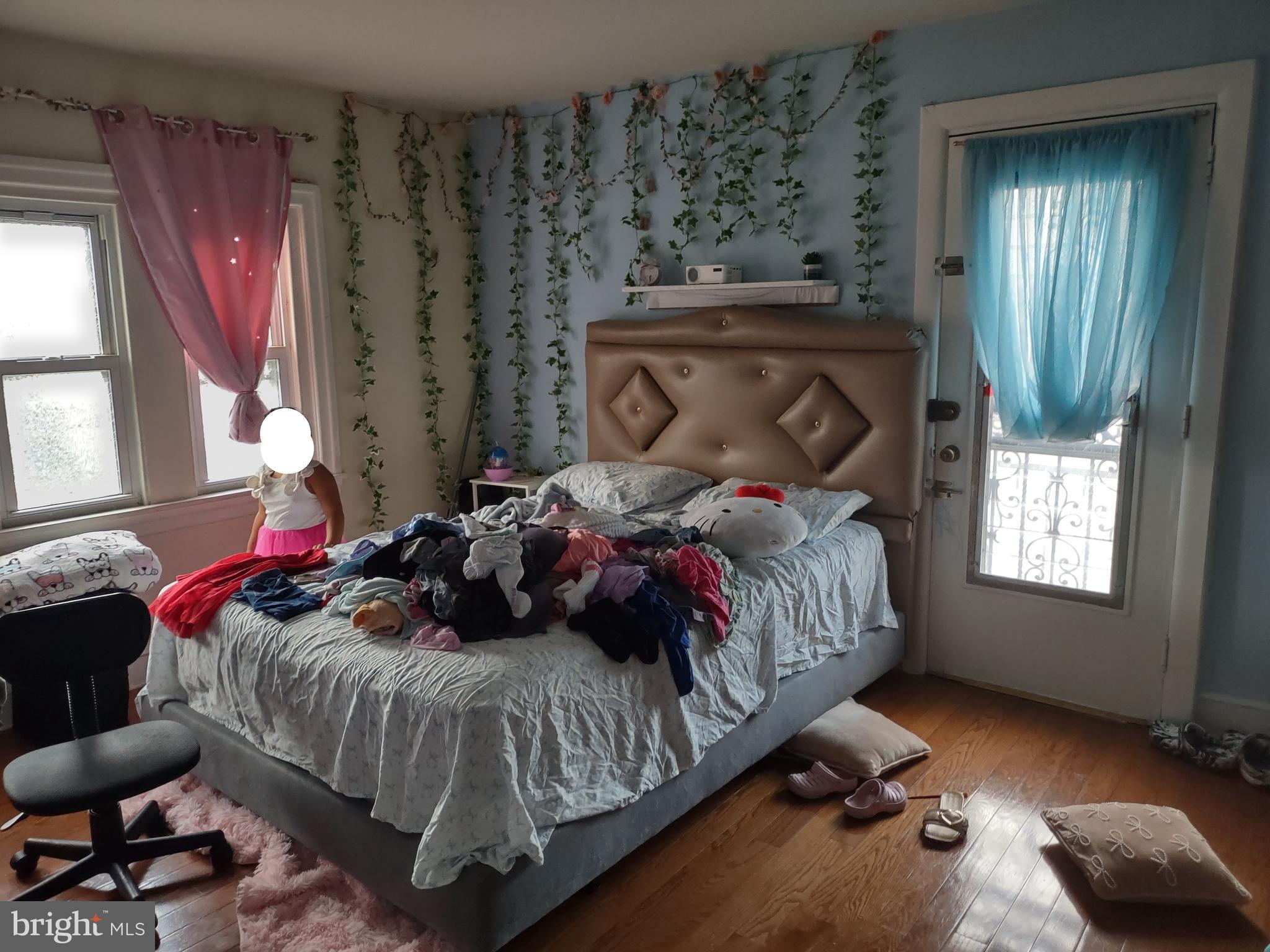 101 Copley Road Upper Darby, PA 19082 - Photo 16 of 36 a bedroom with a bed and window