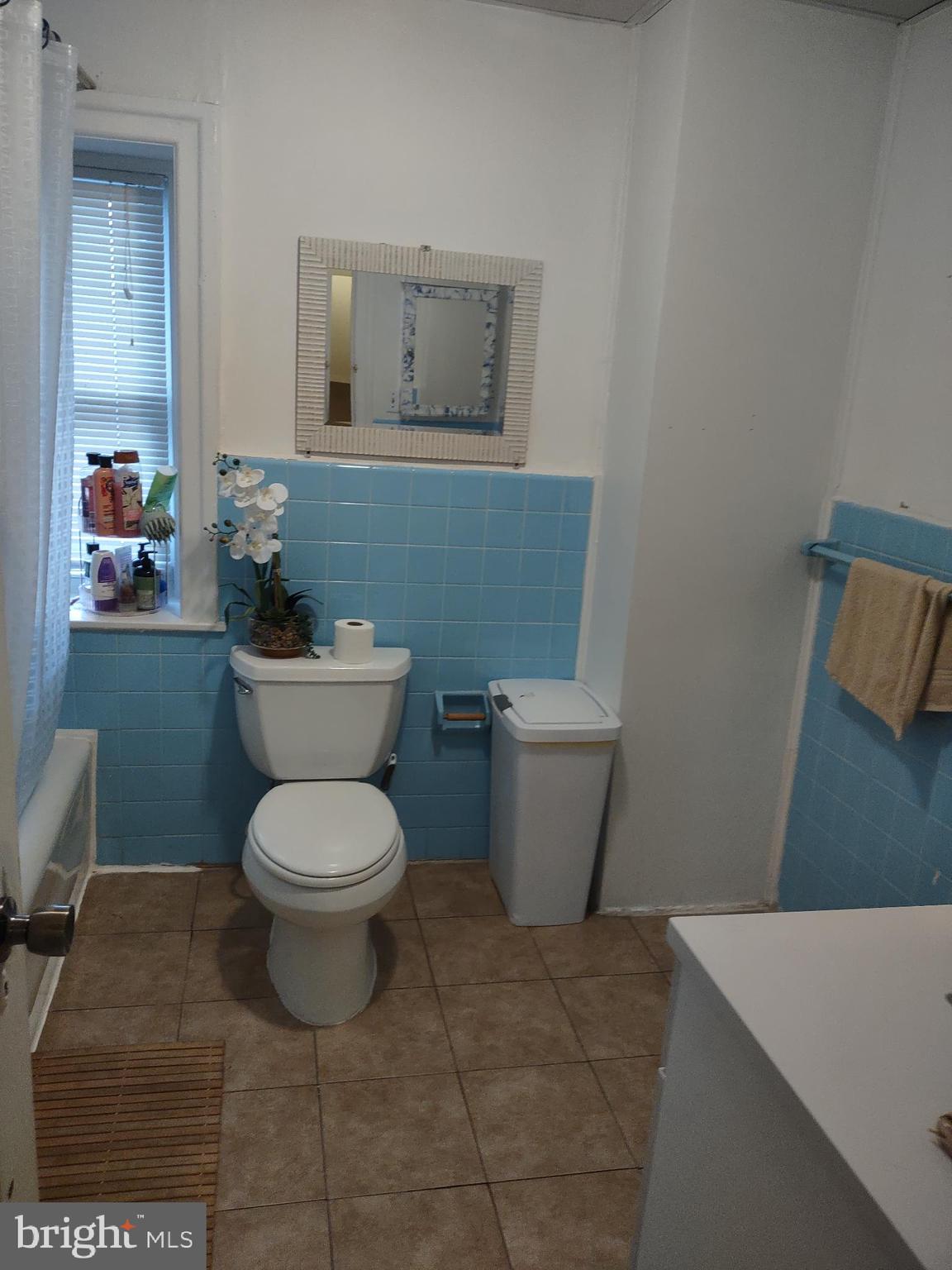 101 Copley Road Upper Darby, PA 19082 - Photo 25 of 36 a bathroom with a toilet a sink and mirror