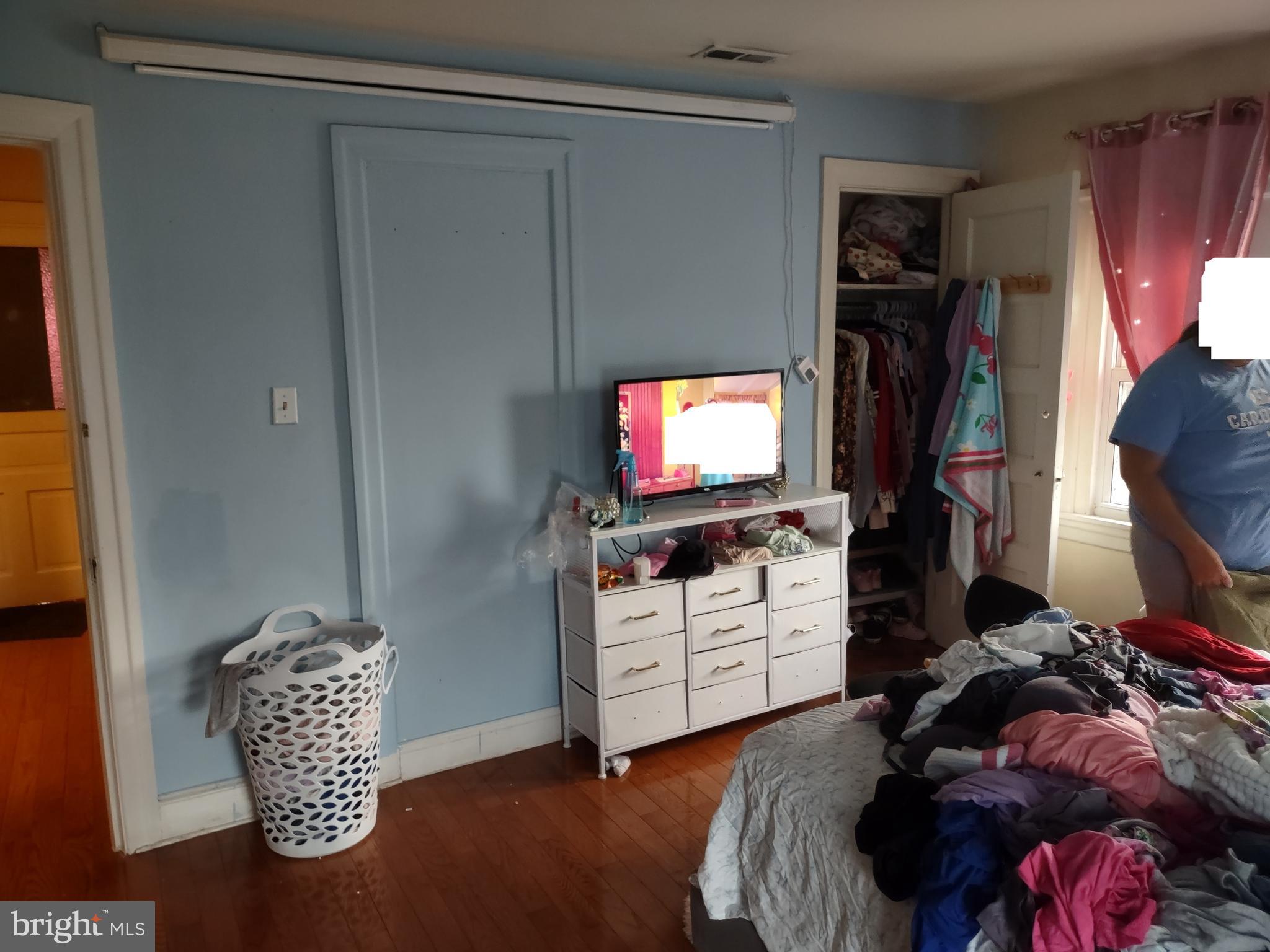 101 Copley Road Upper Darby, PA 19082 - Photo 27 of 36 a bedroom with a bed and a flat screen tv
