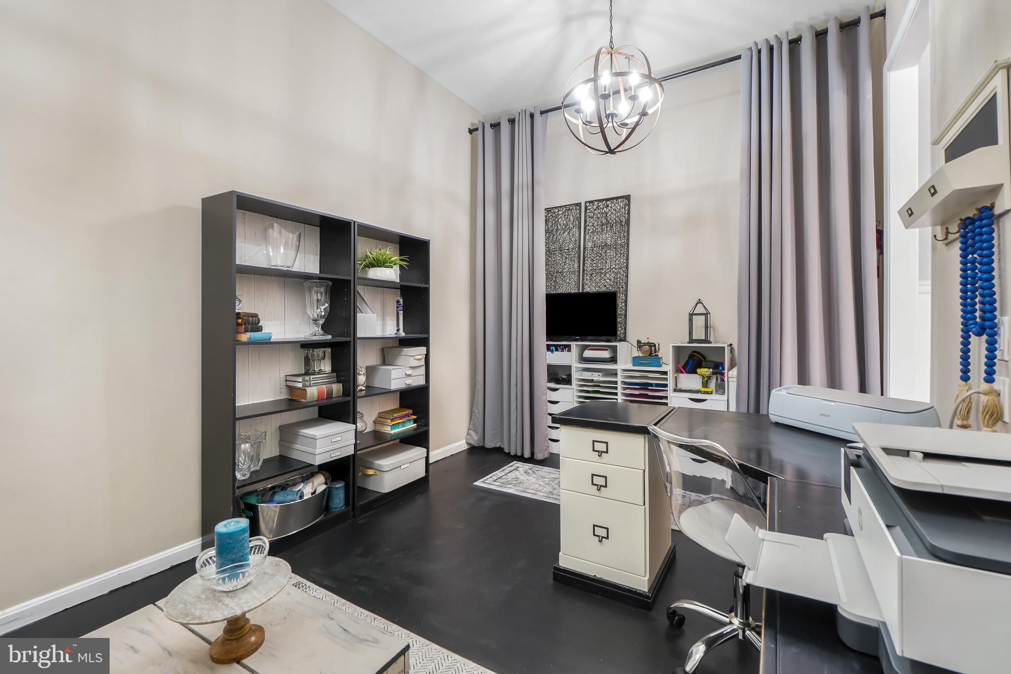 17963 Dumfries Circle Olney, MD 20832 - Photo 15 of 42 a view of a workspace with furniture and a window