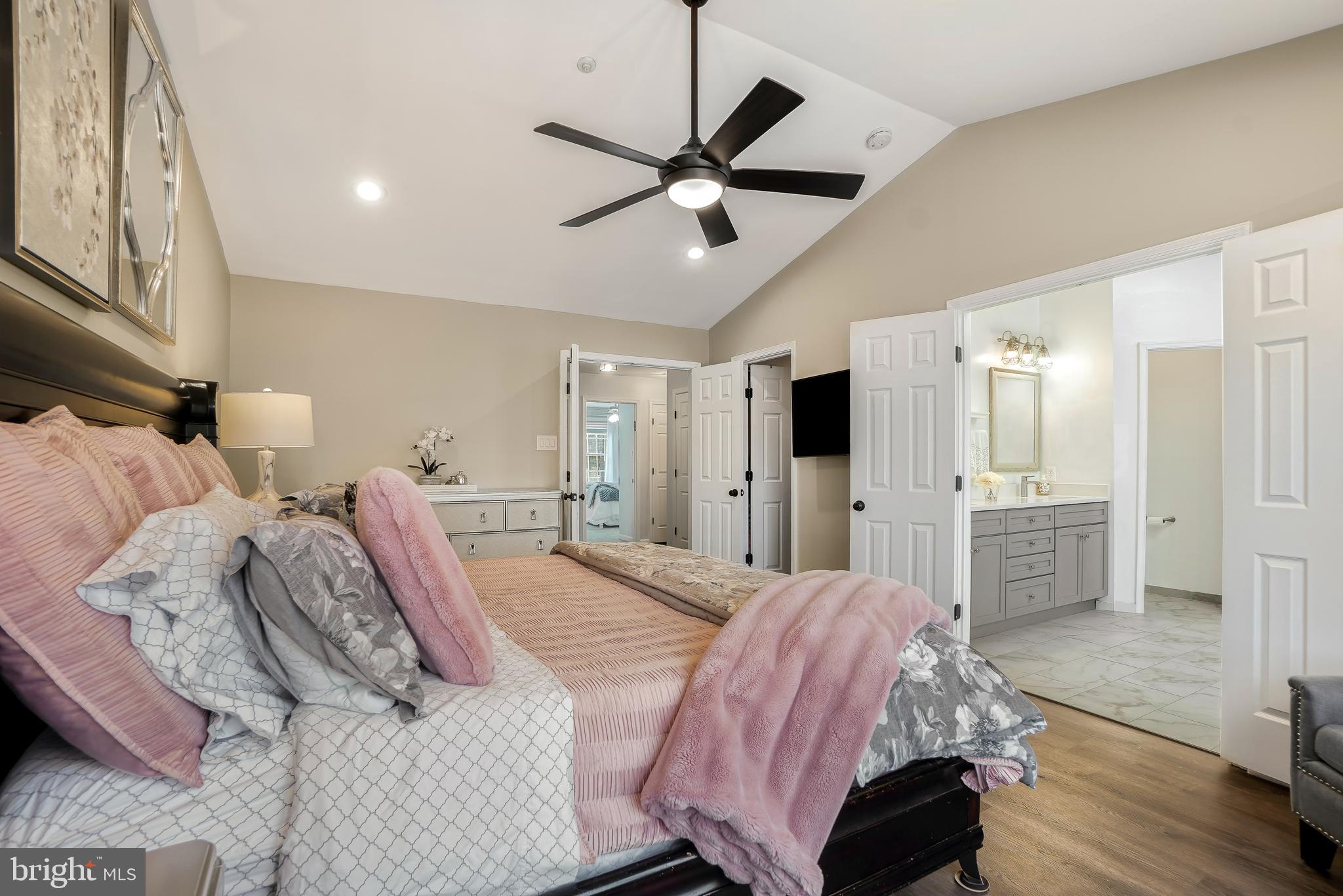 17963 Dumfries Circle Olney, MD 20832 - Photo 18 of 42 a bed room with a bed and a chandelier