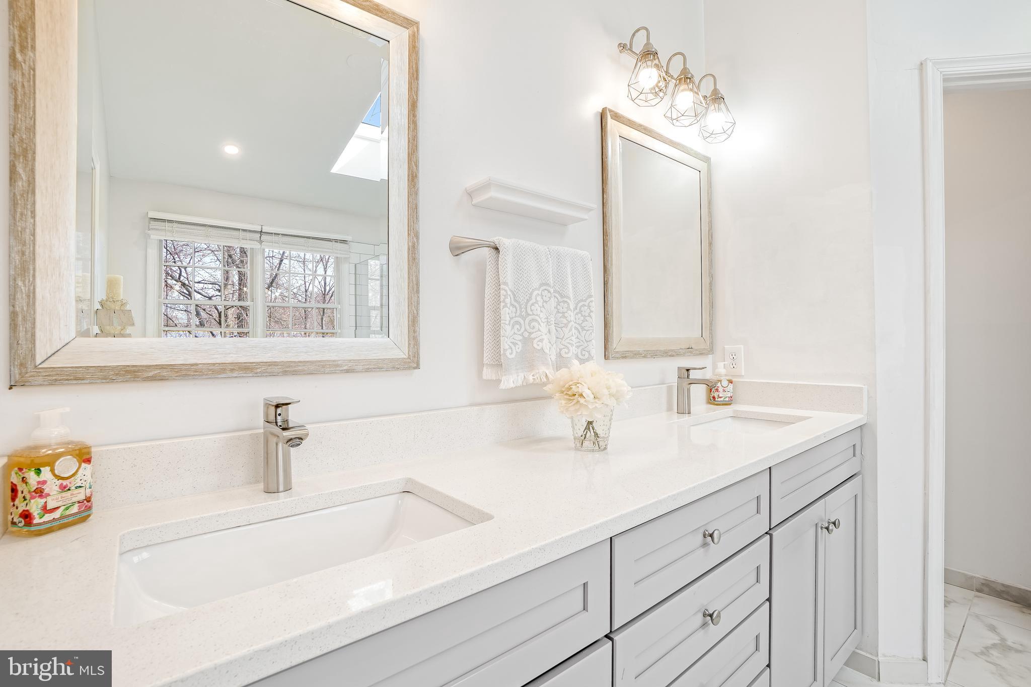 17963 Dumfries Circle Olney, MD 20832 - Photo 20 of 42 a bathroom with a sink and a mirror