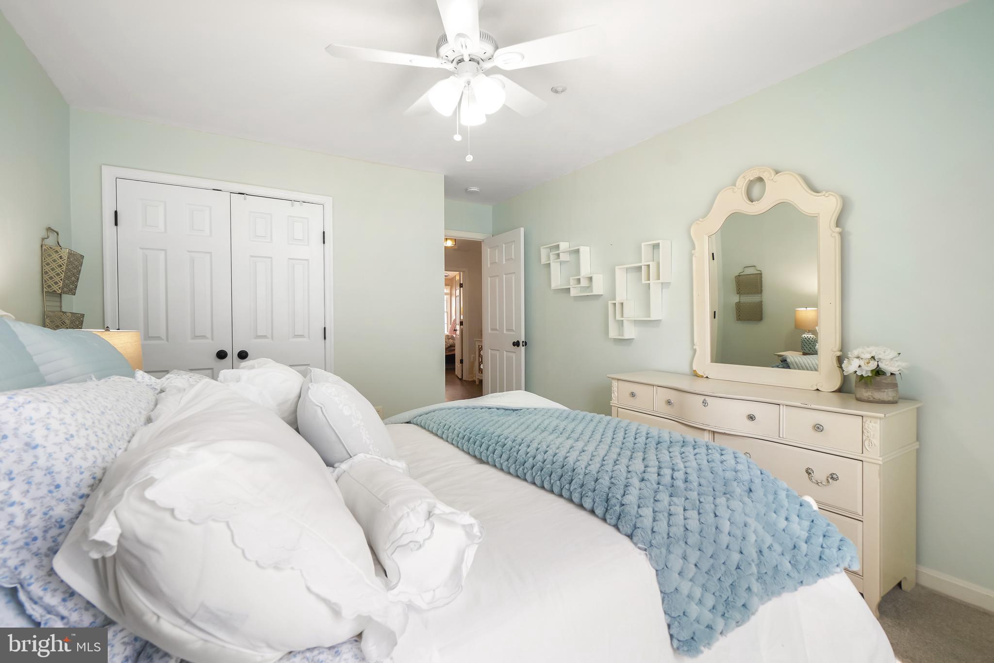 17963 Dumfries Circle Olney, MD 20832 - Photo 24 of 42 a bedroom with a bed and a mirror