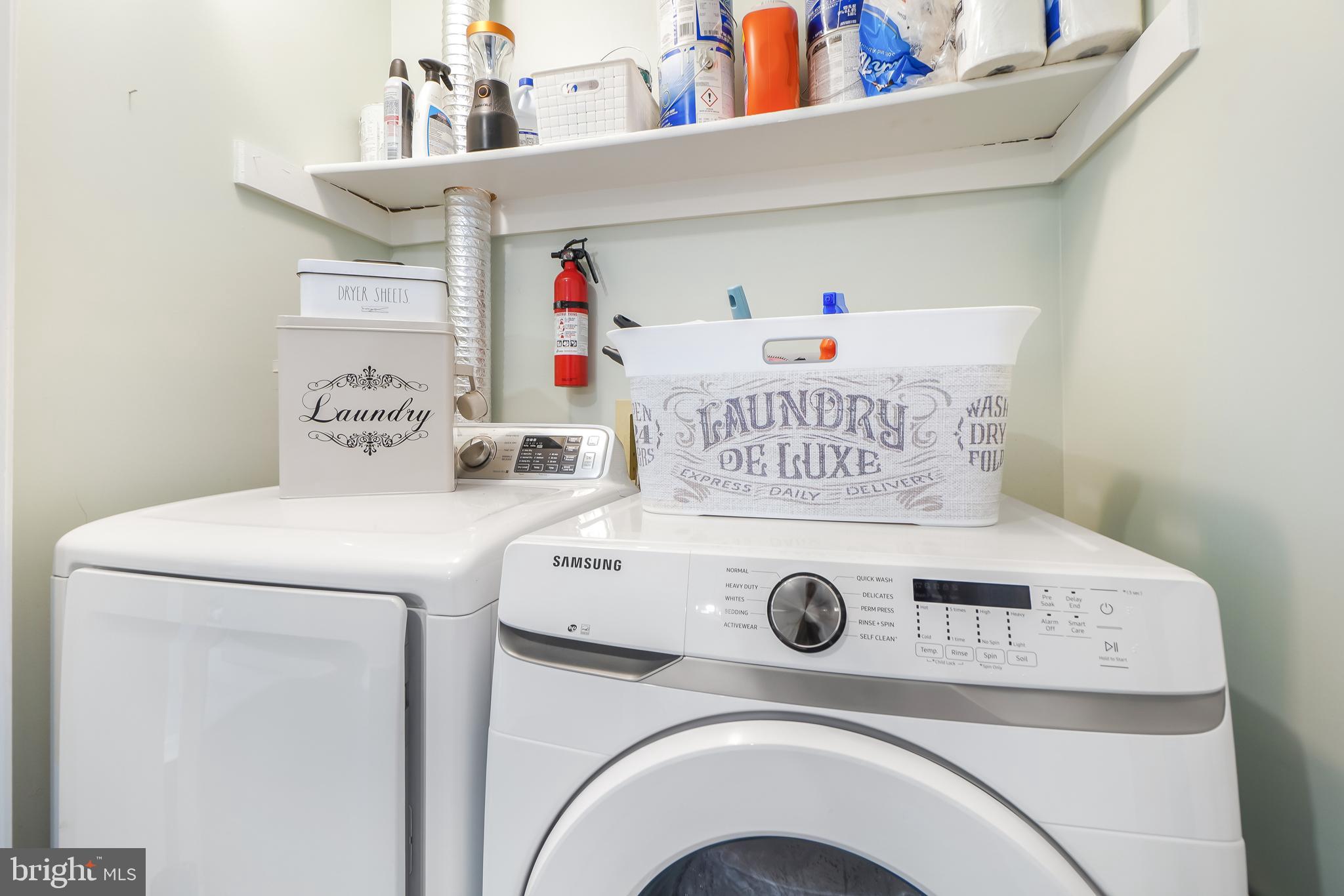 17963 Dumfries Circle Olney, MD 20832 - Photo 27 of 42 a utility room with dryer and washer
