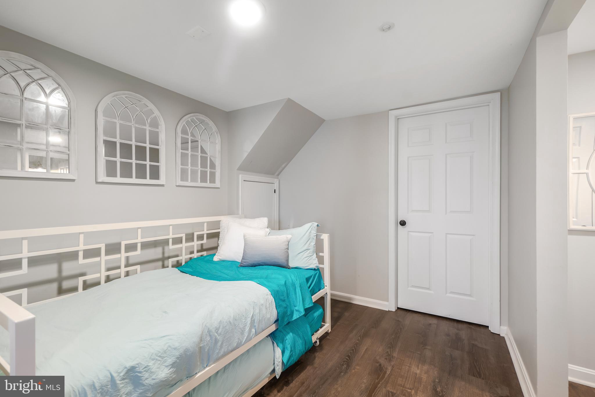 17963 Dumfries Circle Olney, MD 20832 - Photo 30 of 42 a bedroom with a bed and a table in it