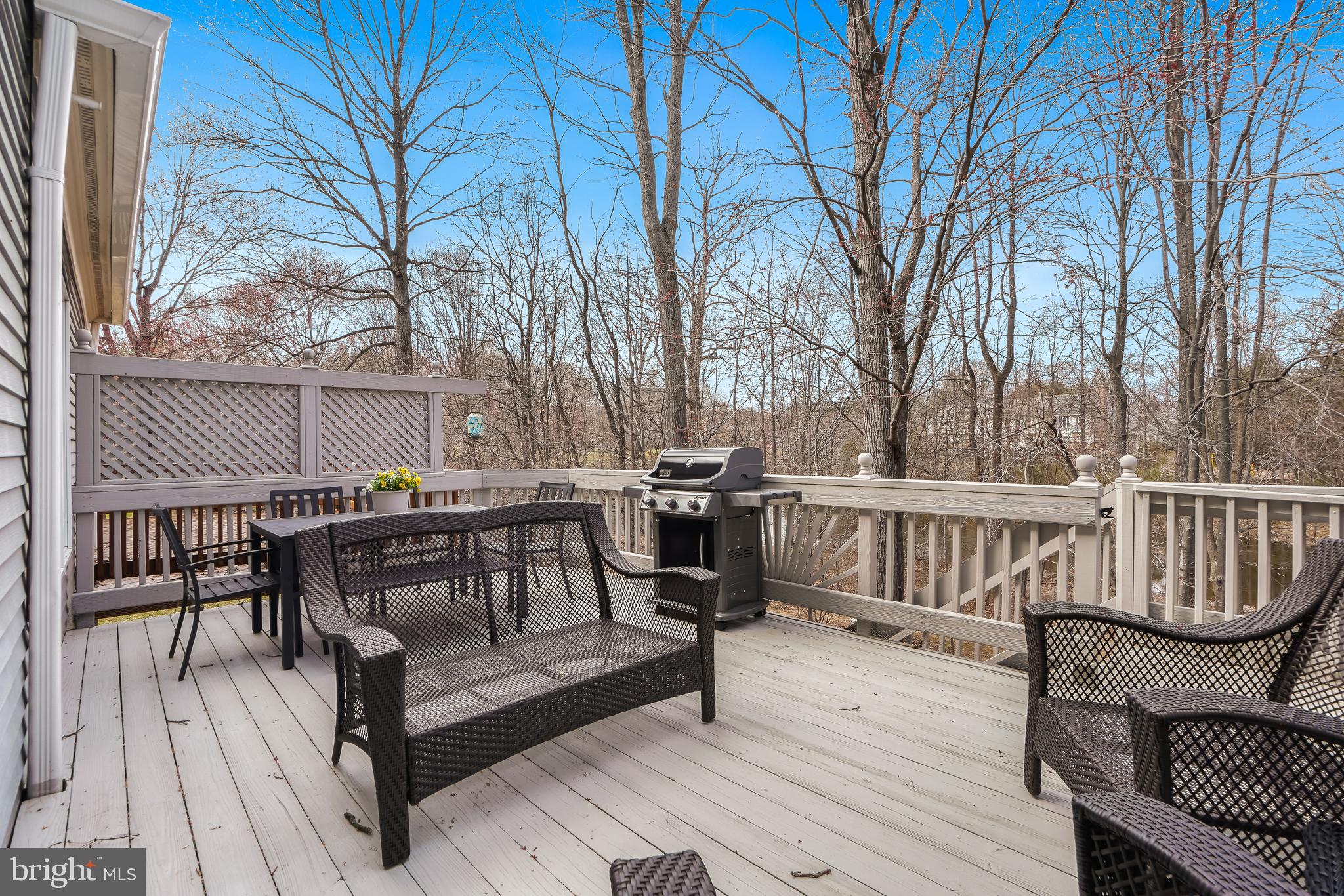 17963 Dumfries Circle Olney, MD 20832 - Photo 33 of 42 a view of a roof deck with wooden floor and outdoor seating