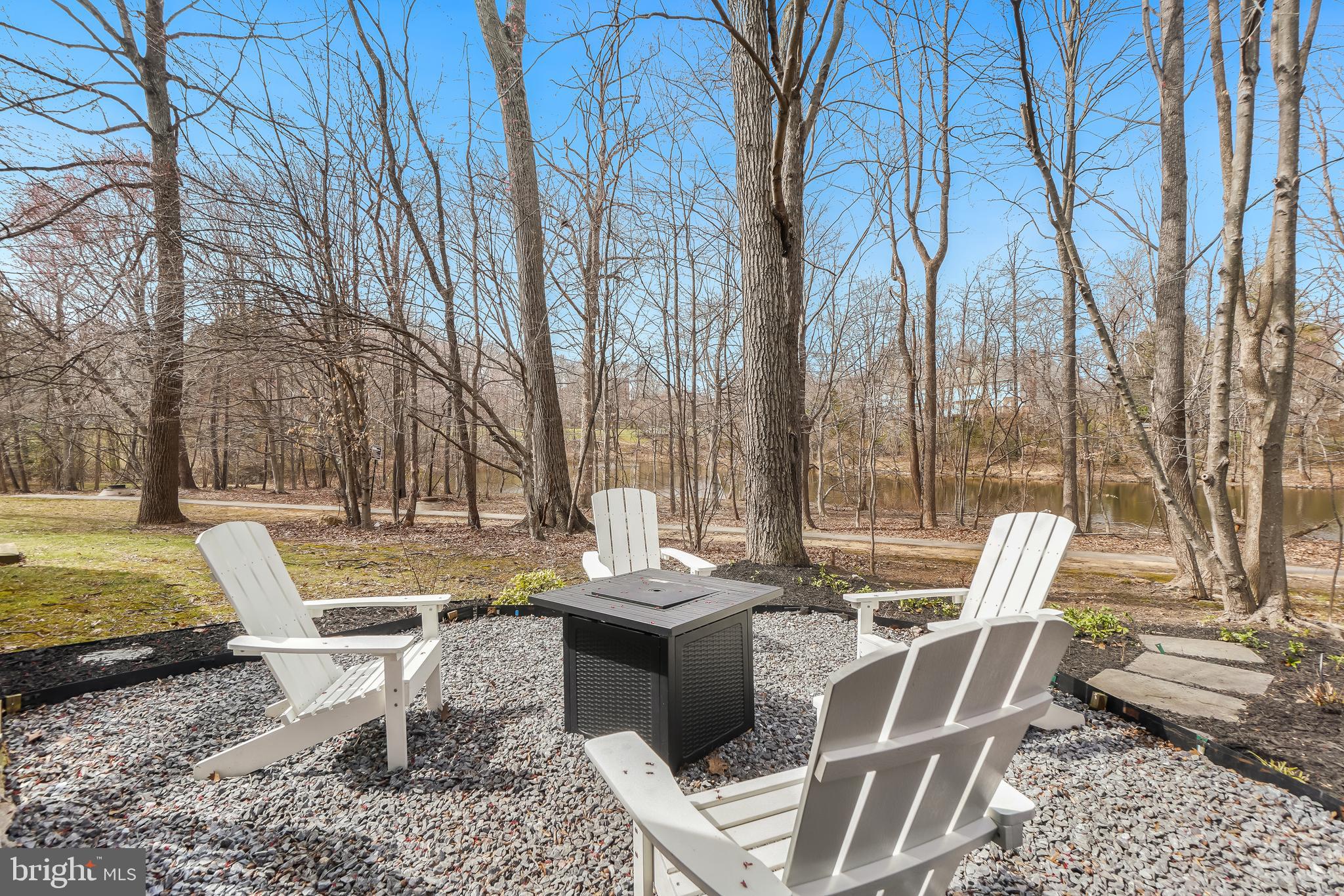 17963 Dumfries Circle Olney, MD 20832 - Photo 35 of 42 a view of a patio with a dining table and chairs