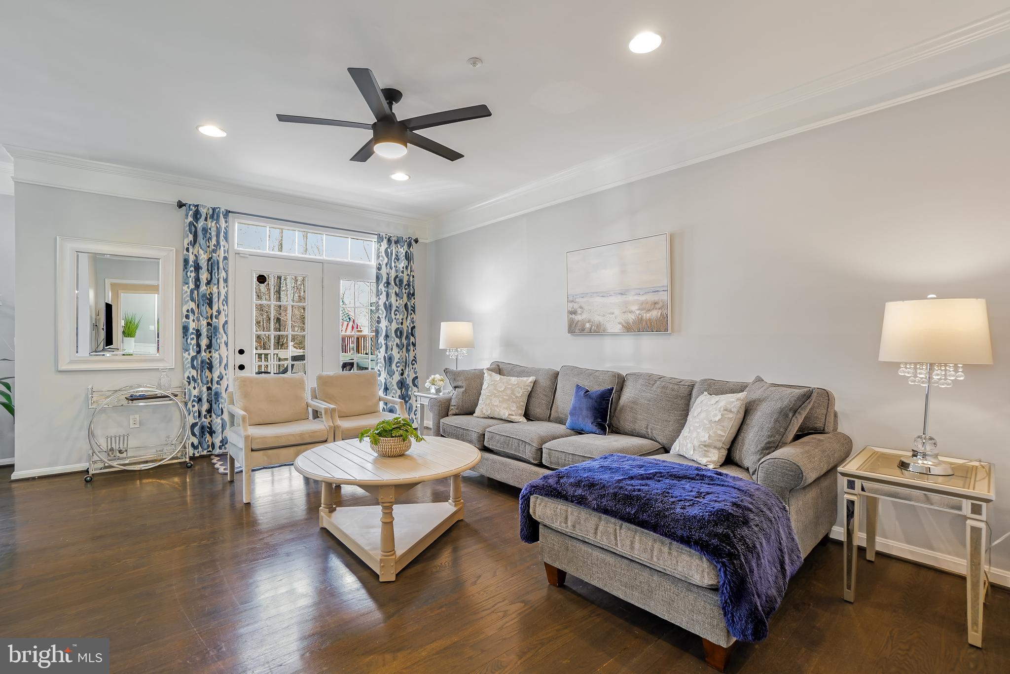 17963 Dumfries Circle Olney, MD 20832 - Photo 10 of 42 a living room with furniture and a wooden floor