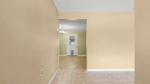 a view of an empty room with a sink