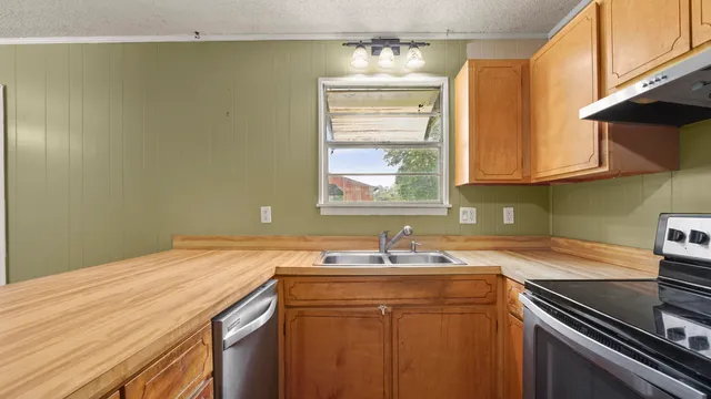 a white refrigerator freezer sitting in a kitchen
