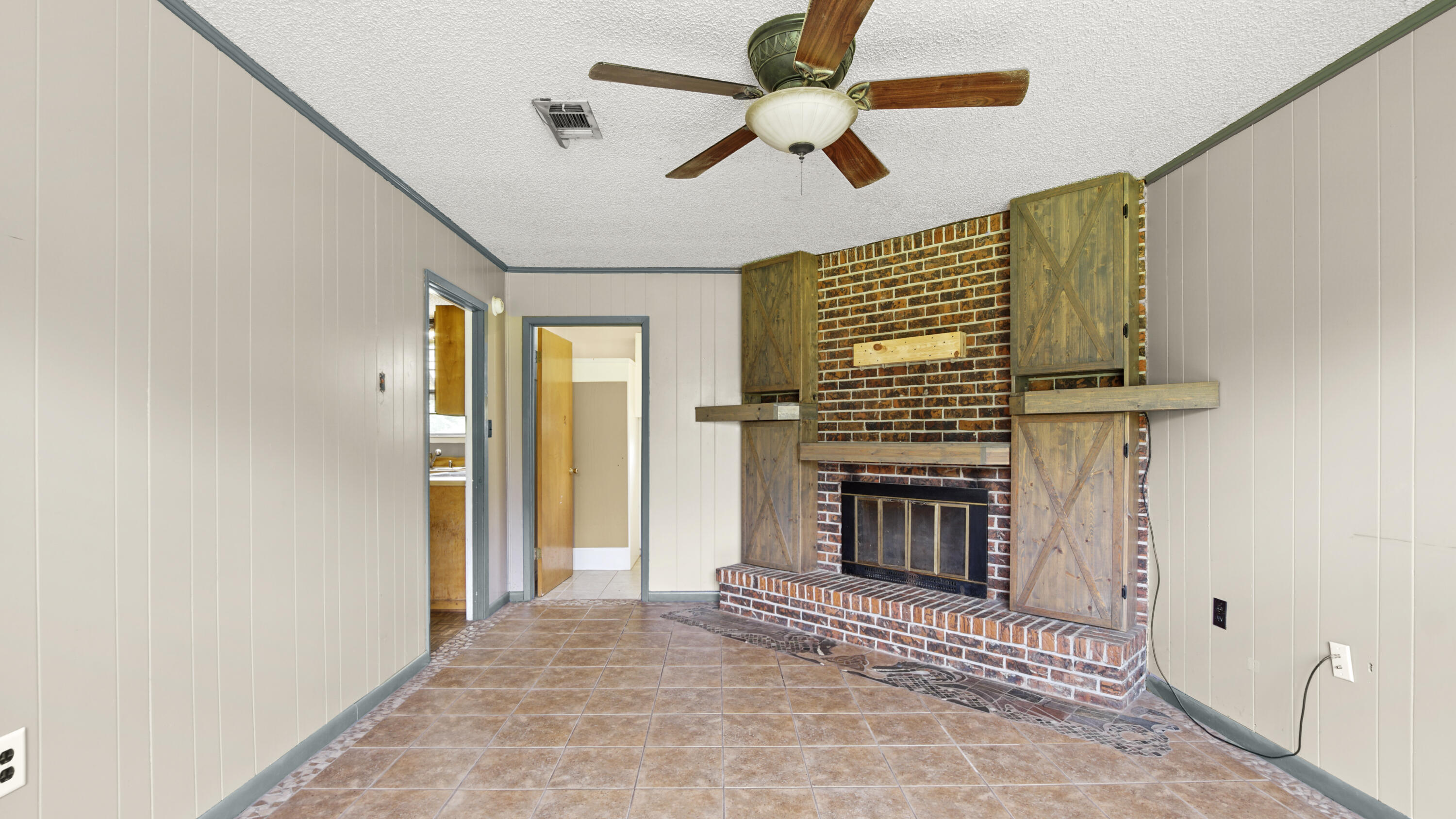 270 Windham Way DeFuniak Springs, FL 32433 - Photo 19 of 51 a view of an empty room with a fireplace and a window