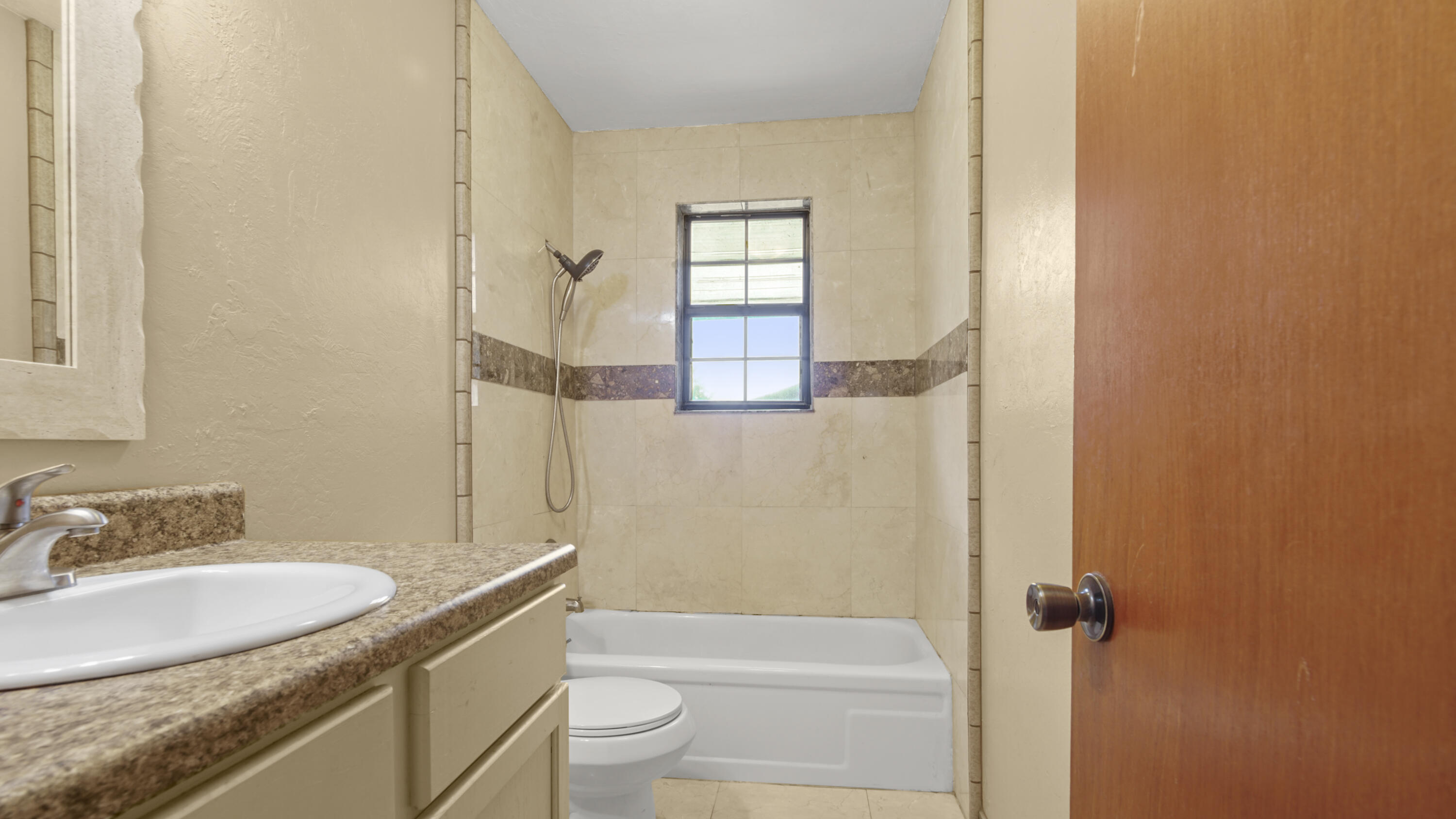 270 Windham Way DeFuniak Springs, FL 32433 - Photo 21 of 51 a bathroom with a granite countertop sink toilet and shower