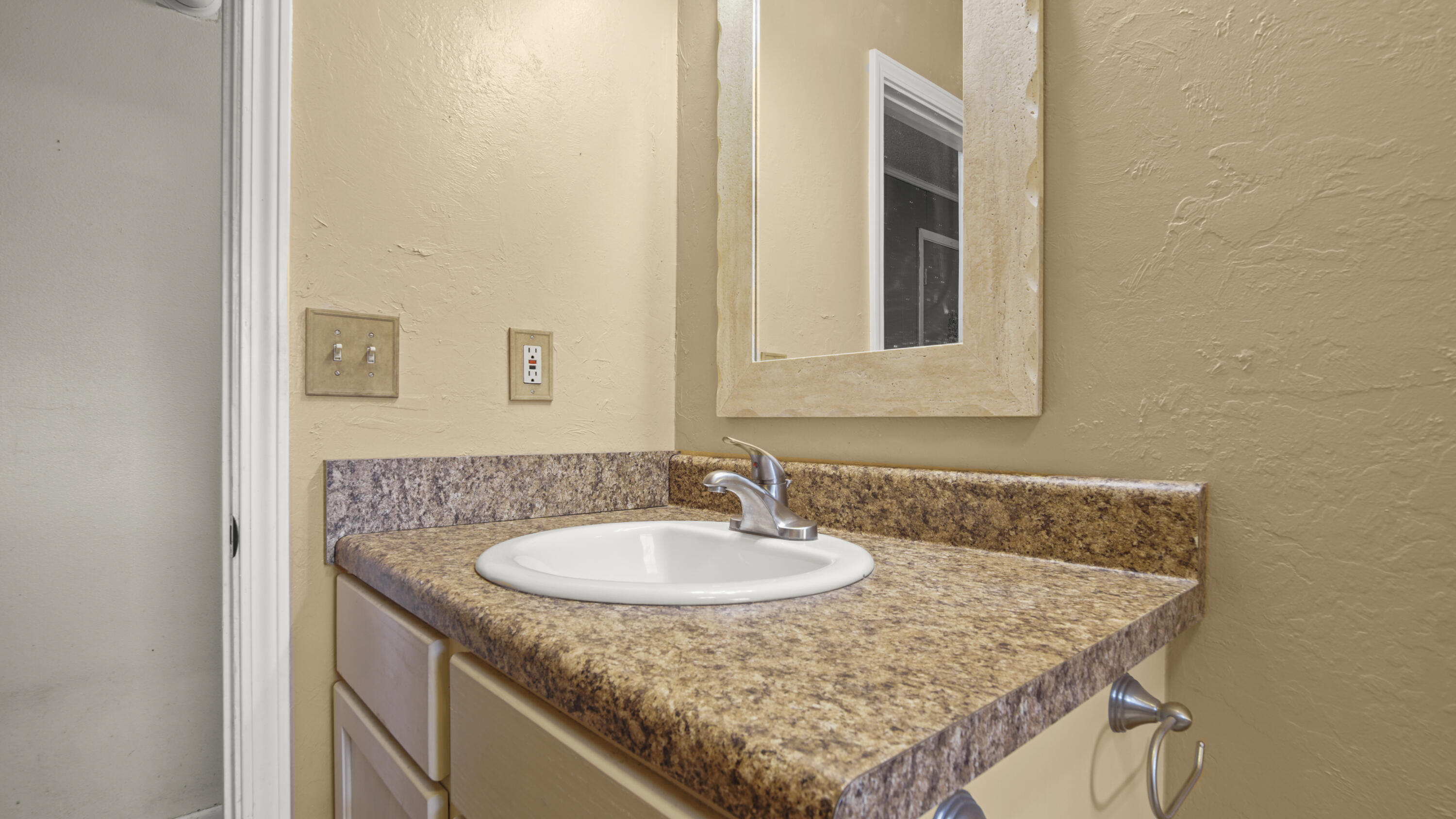 270 Windham Way DeFuniak Springs, FL 32433 - Photo 22 of 51 a bathroom with a granite countertop sink and a mirror