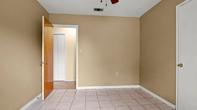 a view of a kitchen with a cabinet and windows